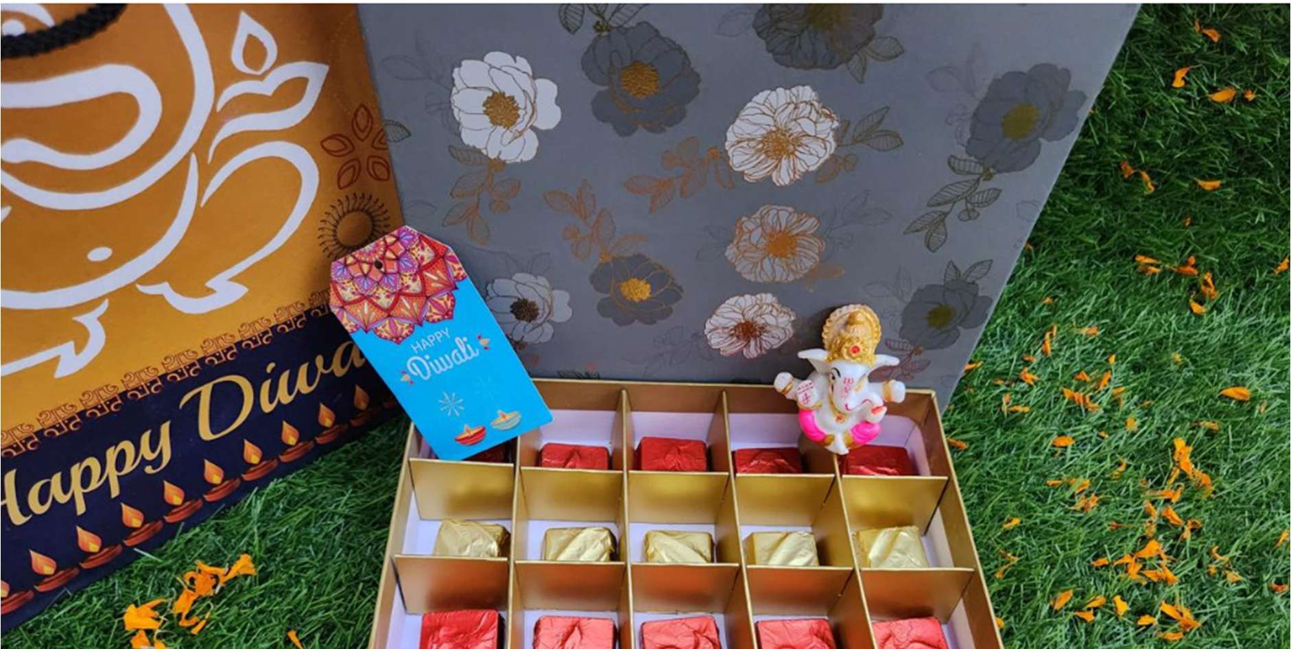 Grand Diwali box with 25 chocolates, floral gift bag and Ganesha idol
