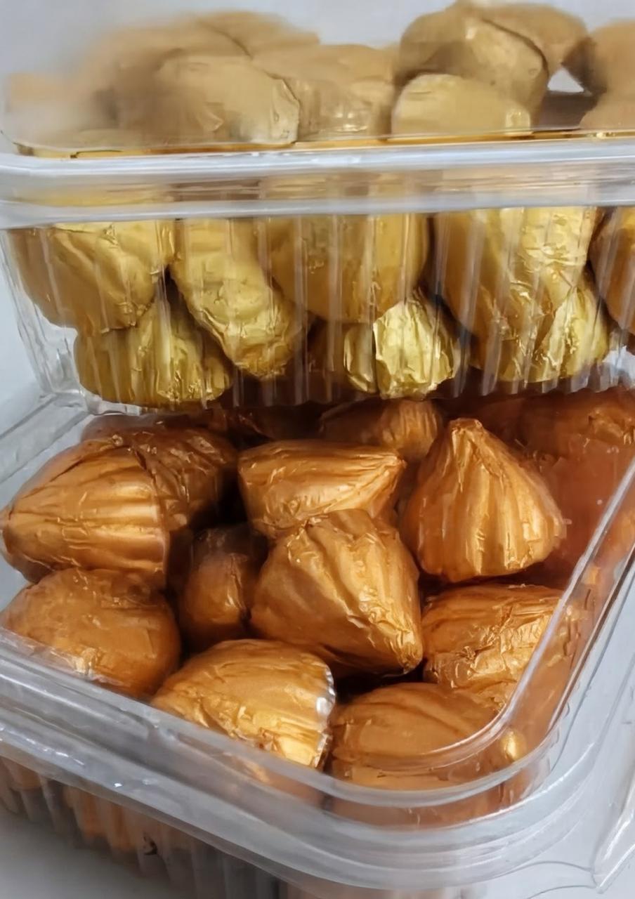 Gold foil wrapped chocolate modaks packed in boxes by the kilo